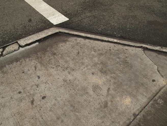 wet-pavement-on-manhattan-street-corner-robert-englebright